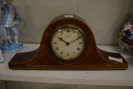 A mahogany mantel clock.