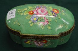 A porcelain casket with hinged cover, green ground with floral decoration.