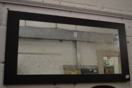 A modern wall mirror.