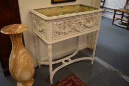 A white painted Continental style floor standing jardiniere with zinc liner.