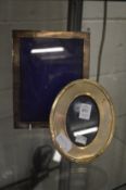 Two silver photograph frames.