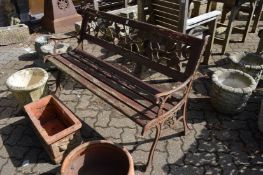 A metal and wooden garden bench.