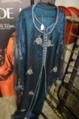 An Eastern ladies two piece blue satin dress.