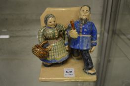 Amusing pottery figure group.