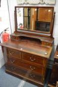 An Edwardian mahogany dressing chest.