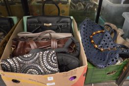 A quantity of ladies handbags.