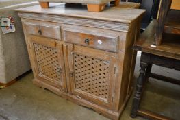 A limed wood dresser base.