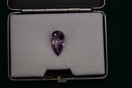 A natural pear shaped amethyst gem stone with certificate.