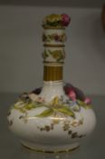 A Rockingham porcelain bottle vase with floral encrusted decoration.