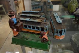 Novelty cast iron money bank and four other cast iron items.