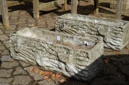 A pair of reconstituted stone garden troughs.