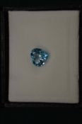 A heart shaped natural blue topaz with certificate.