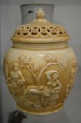 A potpourri jar and cover, moulded decoration with classical figures.