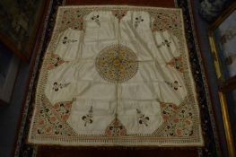 A silk cloth mat, once covered the grand piano for veteran stage director J M Gordon.