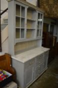 A painted and marble top kitchen dresser.