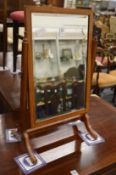 A small mahogany dressing table mirror.