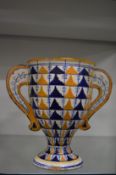 A Cantagalli twin handled vase with stylised painted decoration.