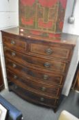 A large inlaid mahogany bow front chest of drawers.