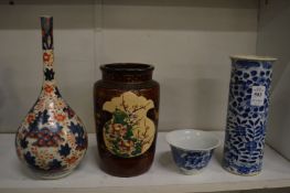 A Chinese blue and white sleeve vase and three other items.