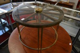 An unusual glass and brass circular wheel shaped coffee table.