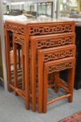 A nest of four Chinese hardwood tables.