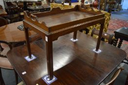 A mahogany butlers tray on stand.
