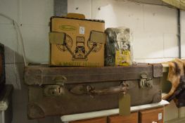 An old projector and a suitcase.