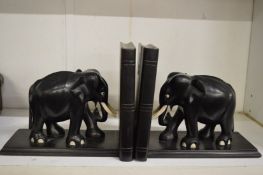 A pair of ebony elephant book ends.