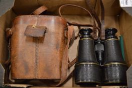 Early pair of binoculars with leather case.