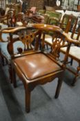 A George III style corner armchair.
