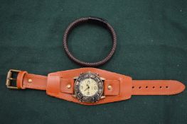 Hand made leather cuff with steel slide catch and a leather cuff watch.