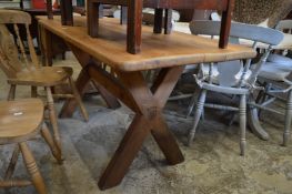 A small pine refectory style dining table.