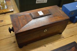 A Victorian rosewood sarcophagus shaped tea caddy.