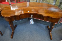 A good Victorian rosewood kidney shaped dressing or writing table.