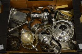 A box of assorted plated items.