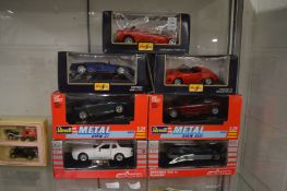 A collection of seven die-cast model cars, boxed.