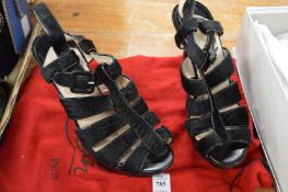 A pair of Christian Louboutin high heeled shoes (worn).