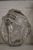 An Art Nouveau embossed pewter dish.