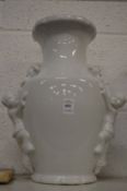 Chinese blanc de chine wall vase mounted with two young boys.