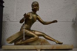 An Art Deco silvered metal model of a young lady on a marble base.