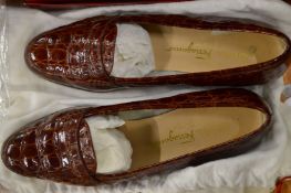 A pair of Salvatore Ferragamo embossed leather shoes.
