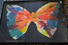In the manner of Damien Hirst, a large spin picture of a butterfly, framed and glazed.