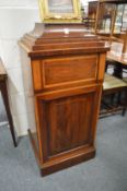 An Edwardian inlaid mahogany pedestal cupboard.