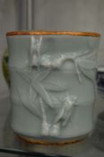 A Chinese celadon glazed bamboo form brush pot.