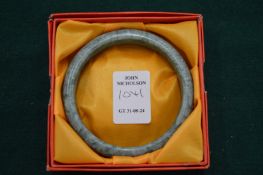 A jade bangle, boxed.