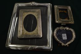 Four various photograph frames.