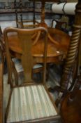 Mahogany extending dining table together with six chairs.