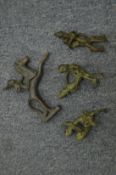 A small group of bronze erotic figures.