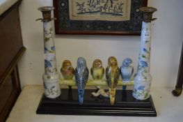 A pair of unusual candelabra modelled as budgies on a branch.
