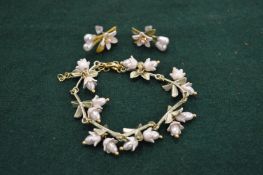 An enamel and faux pearl bracelet and earring set.